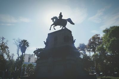 Low angle view of statue against sky