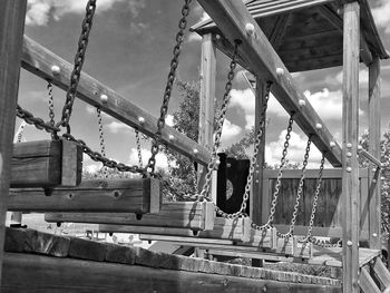 Black and white shot of an old wooden bridge