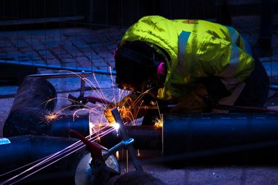 Man welding with sparks flying