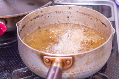 Close-up of cooking pan on stove