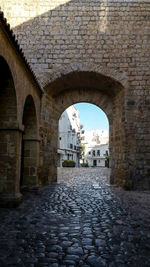 Narrow walkway leading to building