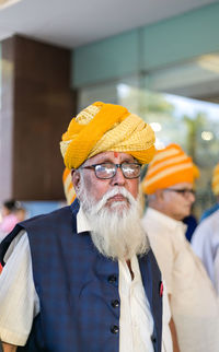 Portrait of old man wearing hat