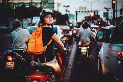 Young woman on street in city