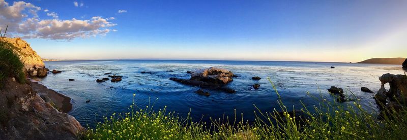 Scenic view of sea against clear blue sky