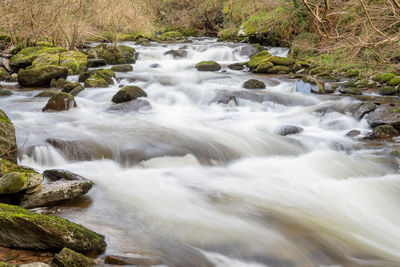 Long exposure of the river flowing through the woods at watersmeet in exmoor national park