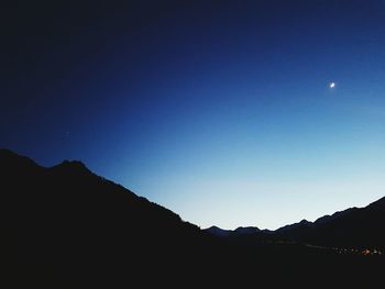 Scenic view of landscape against sky at night