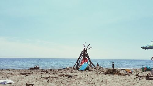 Scenic view of beach against clear sky