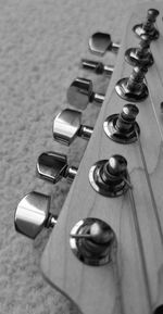 High angle view of a guitar neck on table