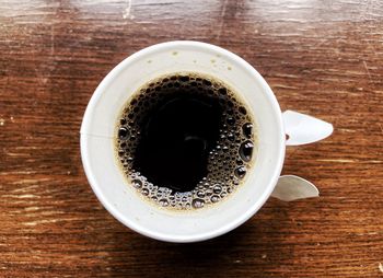 High angle view of black coffee on table