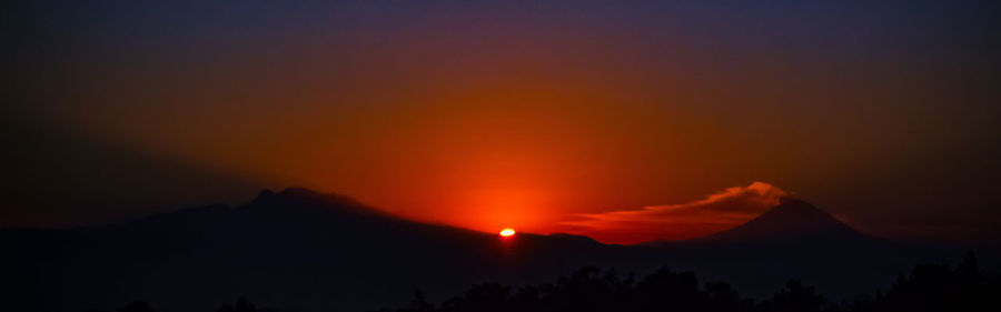 Scenic view of mountains at sunset