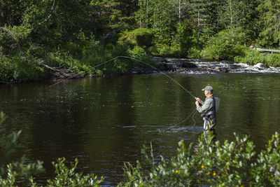 Man fishing in river