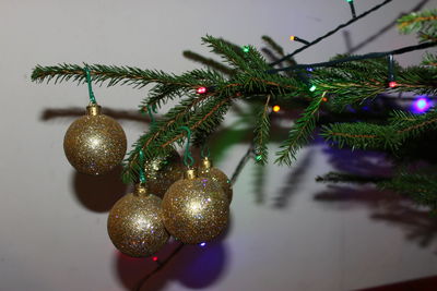 Close-up of christmas decorations hanging on tree