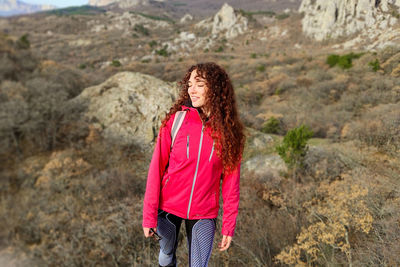 Woman standing on rock