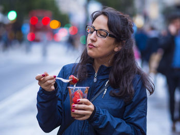 Young woman looking away outdoors