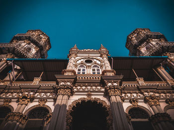 Low angle view of temple building against clear sky