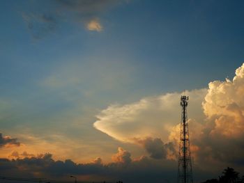 Low angle view of communications tower against sky during sunset