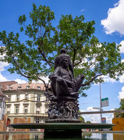 Low angle view of statue against trees