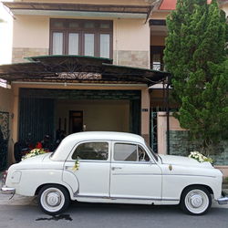 Car parked on street by building