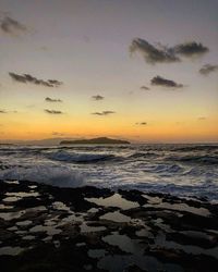 Scenic view of sea against sky during sunset