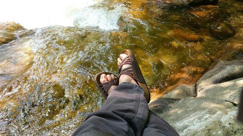 Low section of woman in water