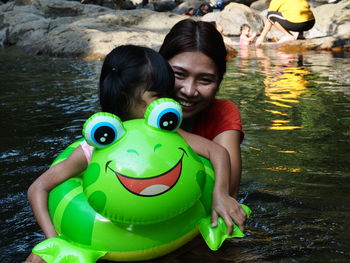 Portrait of a smiling girl in lake