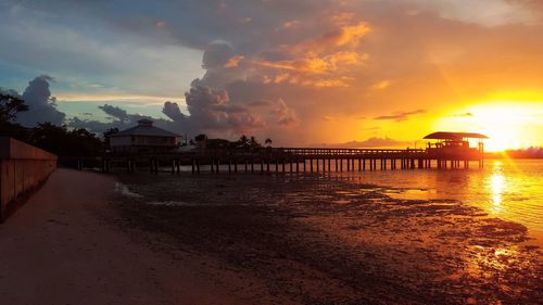 Scenic view of sea against orange sky