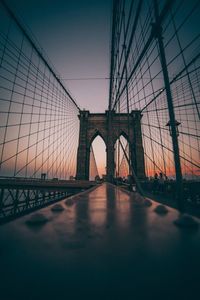 View of suspension bridge against sky during sunset