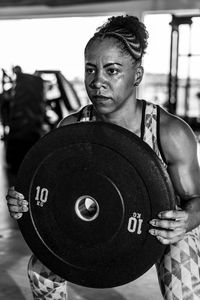 Portrait of man exercising in gym