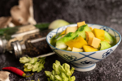 High angle view of fruits in bowl on table