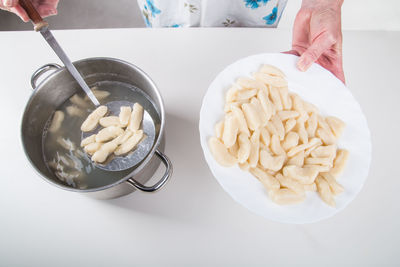 Midsection of person preparing food on table