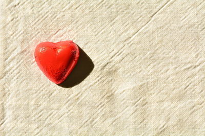 Close-up of heart shape on sand