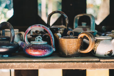 Close-up of old objects on table