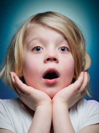 Close-up portrait of shocked girl