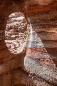 Tomb in petra, jordan carved in colorful stratified sandstone rocks