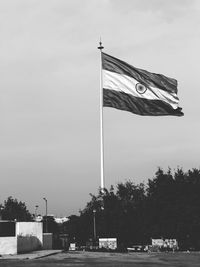 Low angle view of flag against sky