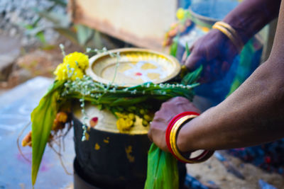 Close-up of hand holding flower