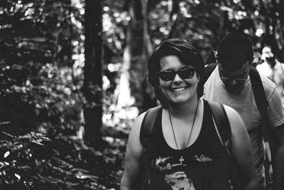 Portrait of a smiling young man in forest