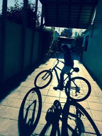 Shadow of boy riding bicycle