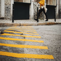 Low section of man on zebra crossing