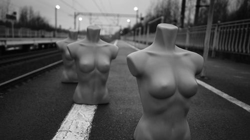 Close-up of mannequins on railroad platform