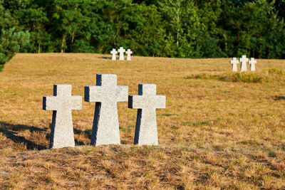 Catholic granite stone crosses in german military cemetery in europe. memorial for dead soldiers