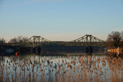 Bridge over river against clear sky