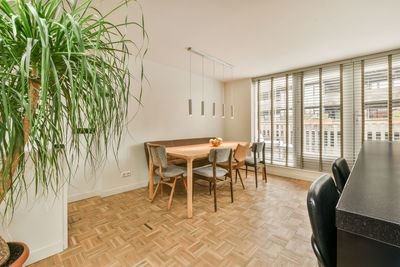 Empty chairs and tables in room