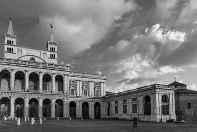 Low angle view of building against cloudy sky