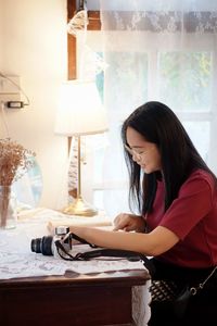 Young businesswoman working at office