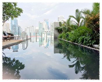 Buildings in city against sky