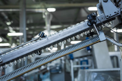 Close-up of illuminated machine part in factory