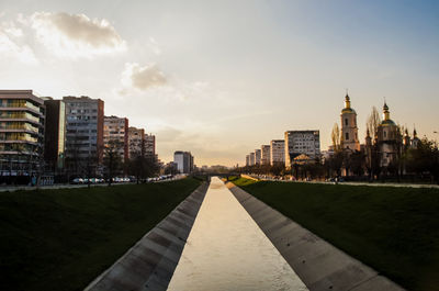 Buildings in city against sky