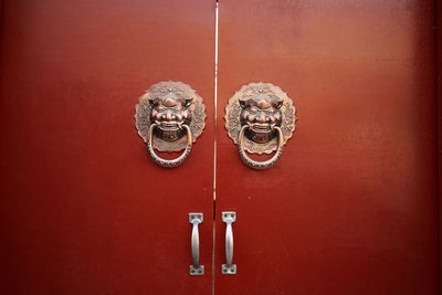 Close-up of door knocker on wall