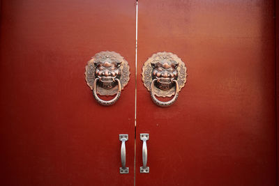 Close-up of metal door knockers